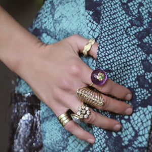 An Amethyst + Emerald Flower Ring