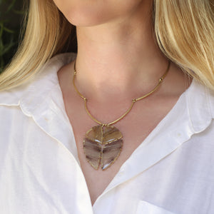 A Four Part Banded Agate and Rutilated Quartz Pendant on Arc Chain