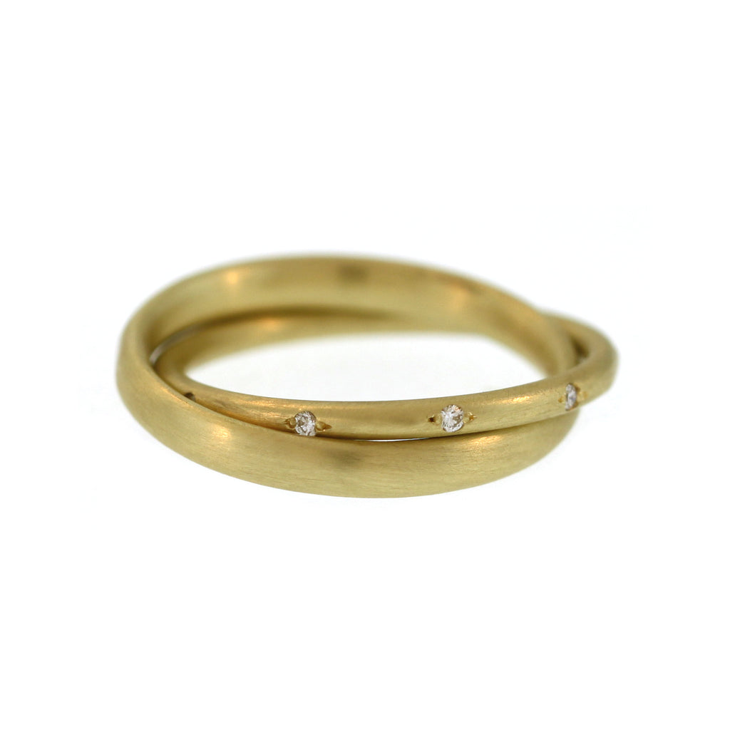 An Entwined Asymmetrical Yellow Gold Ring with Diamonds