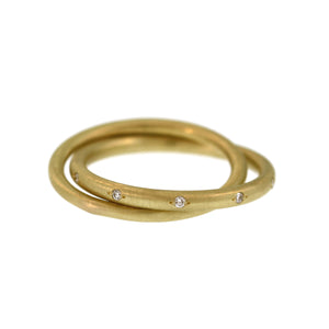 An Entwined Asymmetrical Yellow Gold Ring with Diamonds