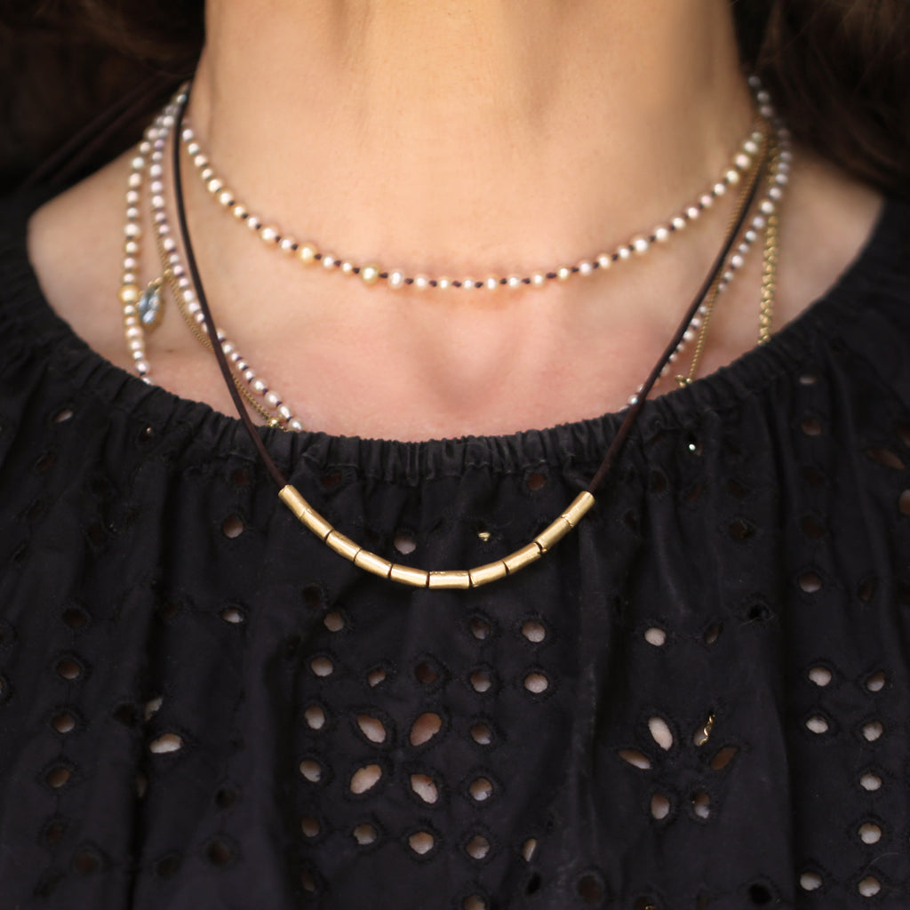 A Gold Tube Bead Necklace