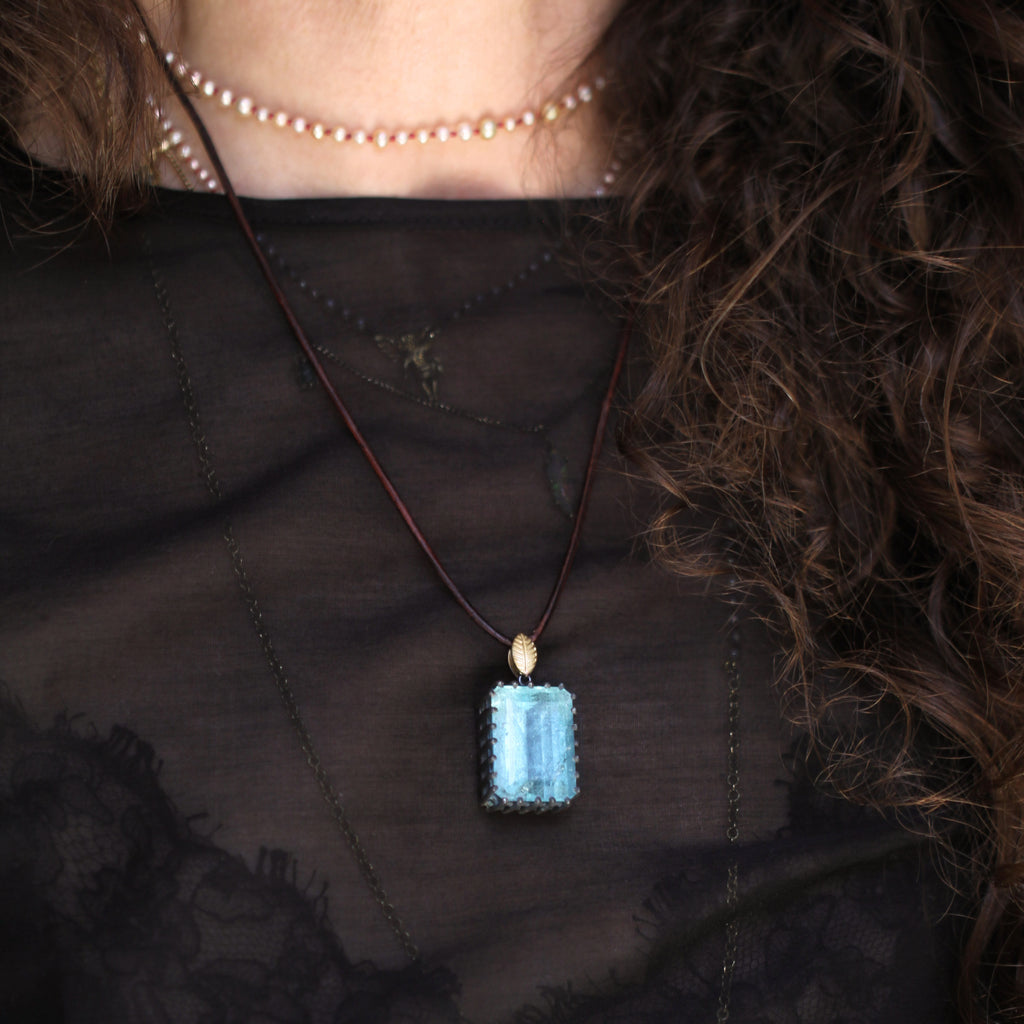 An Aquamarine + Lotus Leaf Pendant