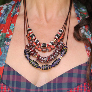 An Oblong Dark Blue Swirled Bead Necklace