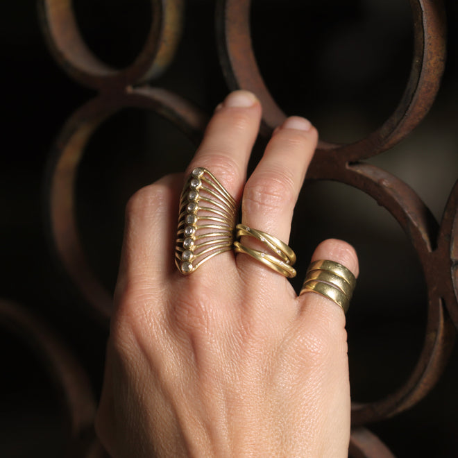 An Entwined Asymmetrical Yellow Gold Ring with Diamonds