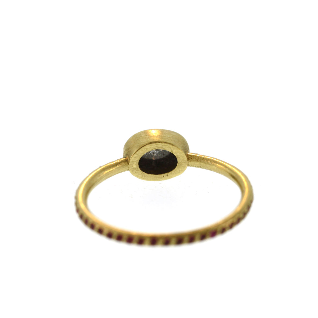 An Oval Grey Diamond Ruby Pavé Ring