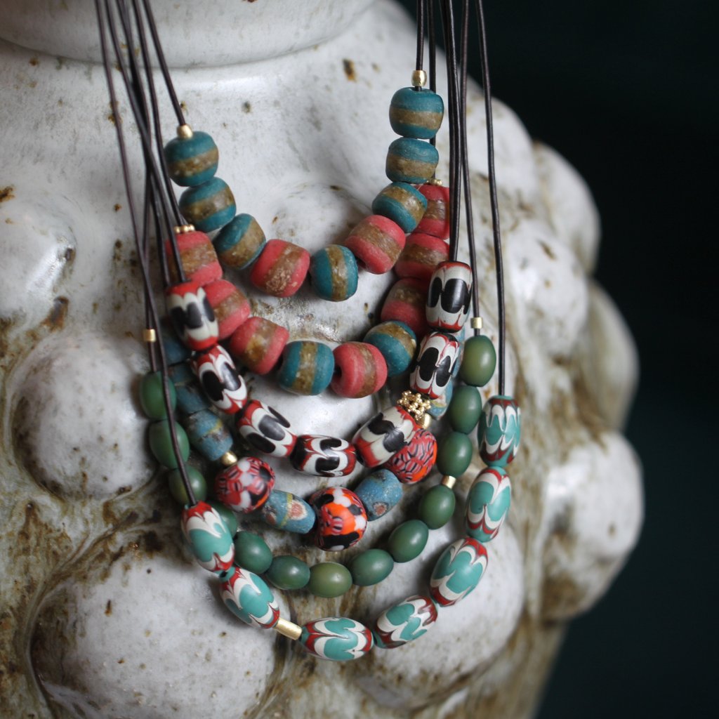 A Red, Turquoise, + White Swirl Bead Necklace