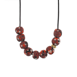 An Orange Patterned Recycled Glass Bead Necklace